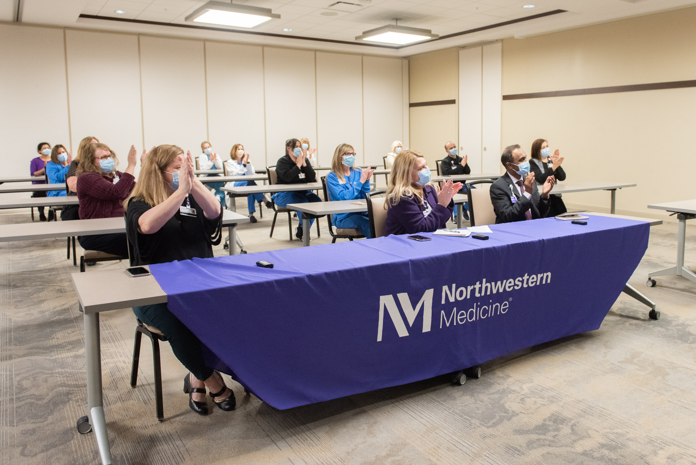 Staff at Northwestern Medicine Huntley Hospital applauds announcement of recognition for their commitment to patients and to nurses.