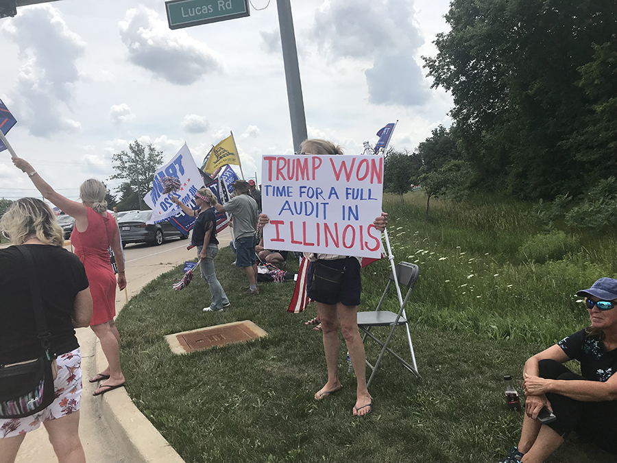 Protesters stand outside of MCC