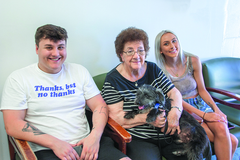 Newly adopted dog is picked up by (L to R) Shannon and Gail Madura along with Matie Mochan at Animal House Shelter in Huntley.