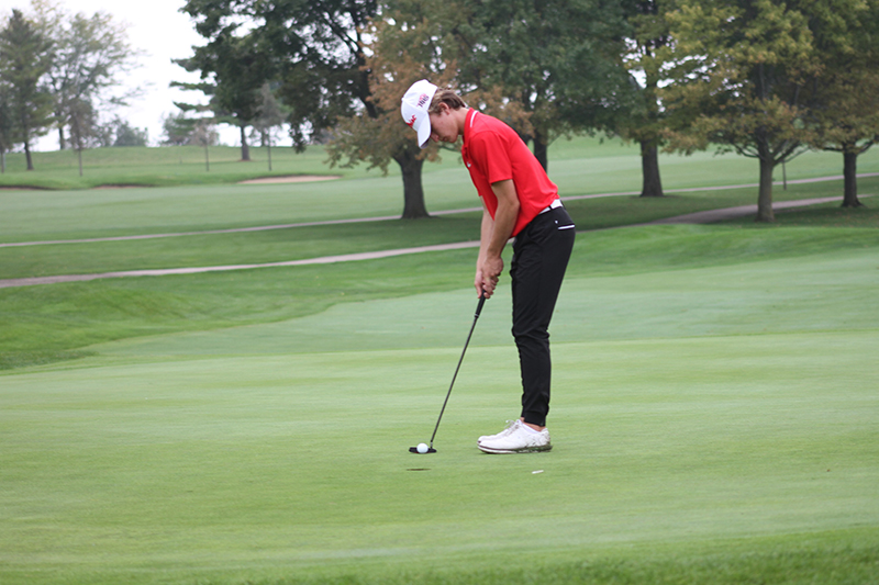 HHS senior golfer Sam Locascio concentrates on a shot in the Class 3A regional meet at Randall Oaks Golf Course.
