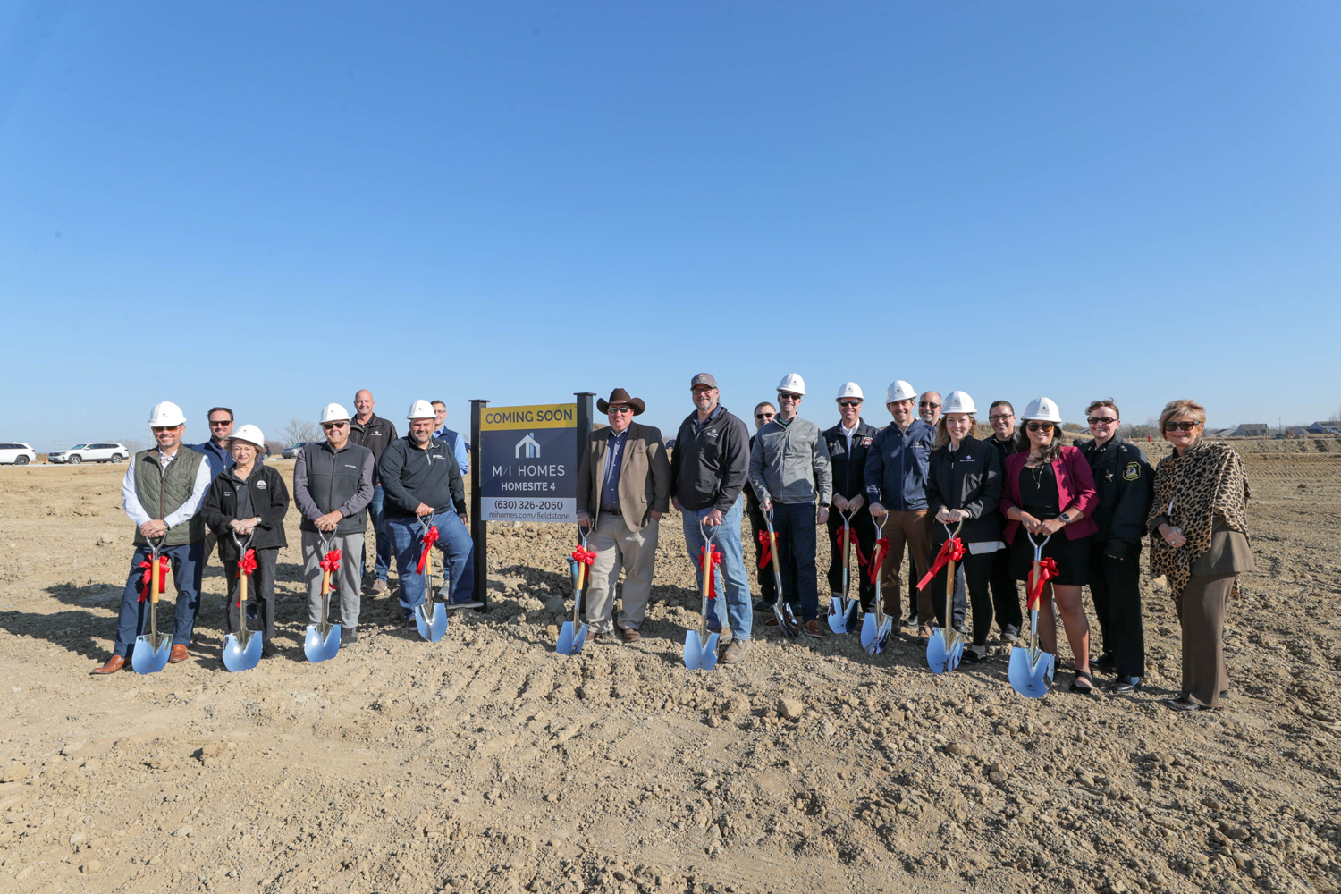 Representatives from MI Homes and the Village of Huntley gathered for a groundbreaking event marking the start of construction on two model homes at the new single-family home