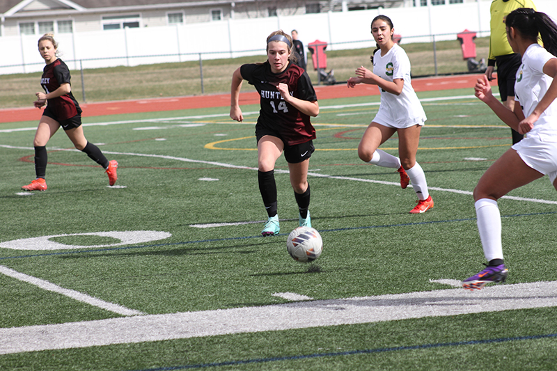 Huntley junior Sophia Bruns battles for control of the ball against Stevenson March 16.