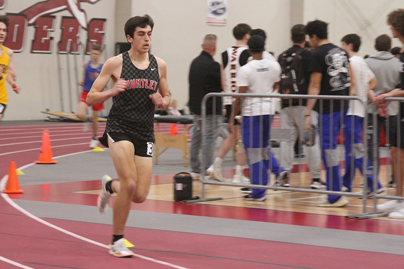 Huntley senior runner John Collins competes at the Fox Valley Conference indoor track and field meet.