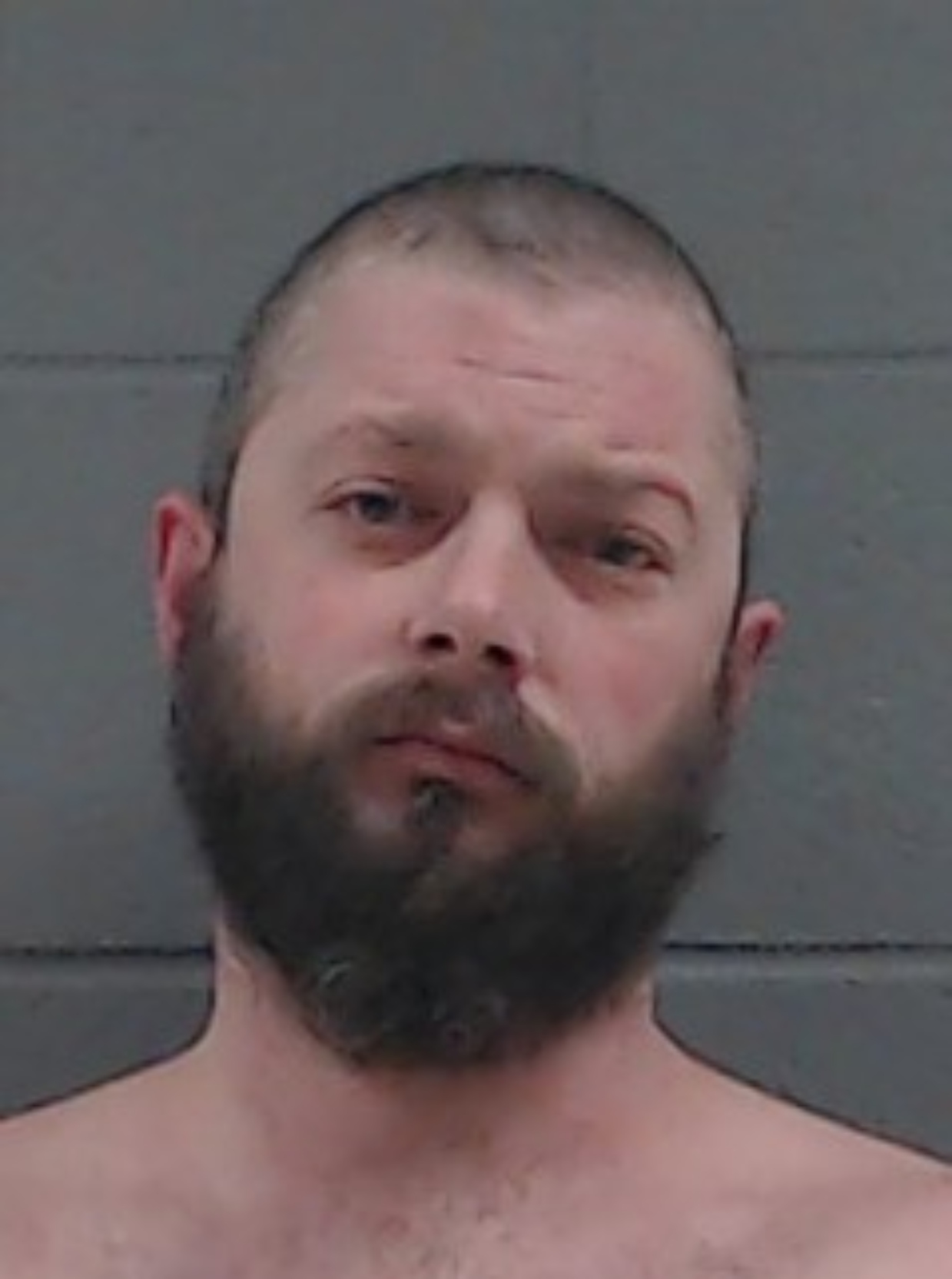 Brandon M. Smith, 39, of Woodstock was taken into custody on March 29 after threatening to harm public officials