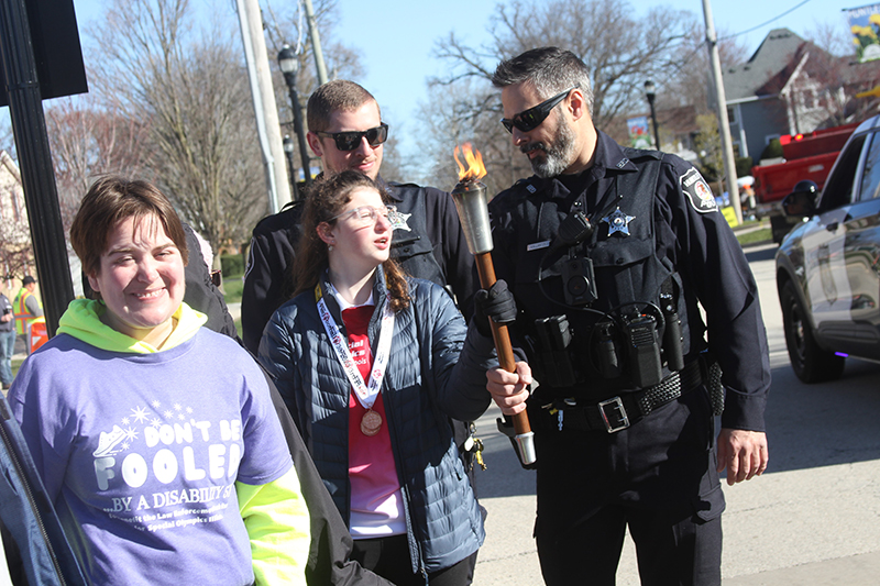 The Huntley Police Department hosted “Don't Be Fooled - by a Disability” 5K run to benefit the Law Enforcement Torch Run April 6 at Huntley Town Square. From left: Special Olympic athlete Sabrina Veverka, Huntley Police Officer Max Riedel, Special Olympics athlete Bella Kurash and Huntley Police Officer Theo Kallantzes.