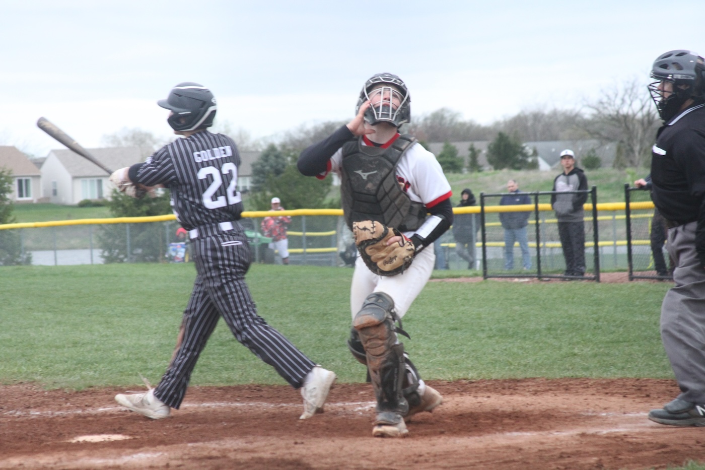 Huntley senior catcher Quinn Drews handles his duties against Prairie Ridge.