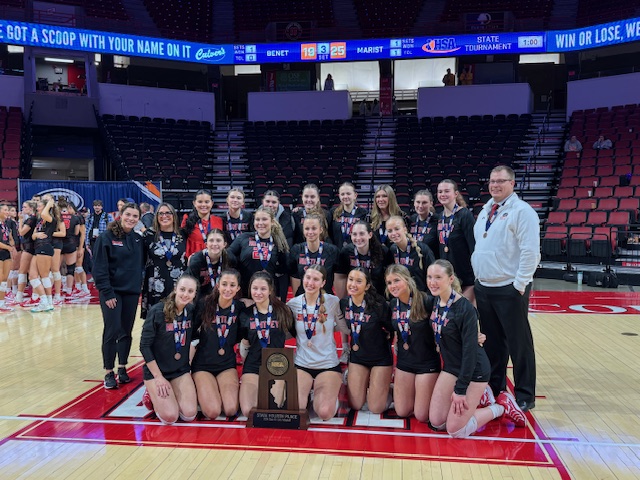 Huntley girls volleyball team celebrates after winning its IHSA Class 4A State Volleyball fourth-place trophy. Photo provided by Huntley High School.